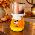 Candy corn 3D printed jar candle holder with candle in a warm fall setting
