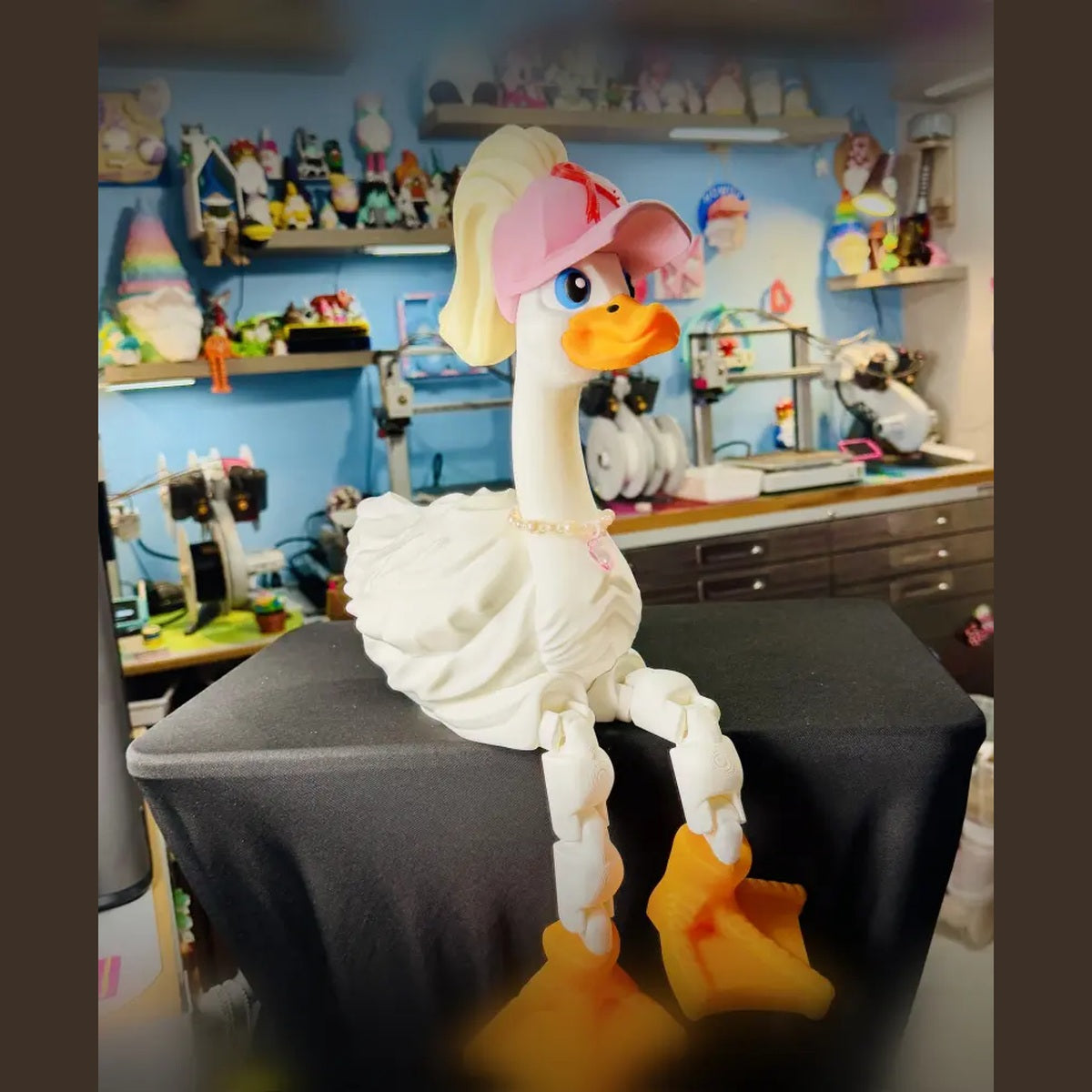 Dress-Up Goose wearing red ribbon ponytail hat