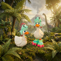 Prints & Giggles 3D dinosaur themed rubber ducks wearing T-Rex hats in a prehistoric jungle setting with a volcano.