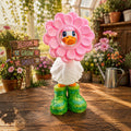 Prints & Giggles 3D goose figurine wearing a pink petal flower headpiece and green leaf-patterned rain boots.