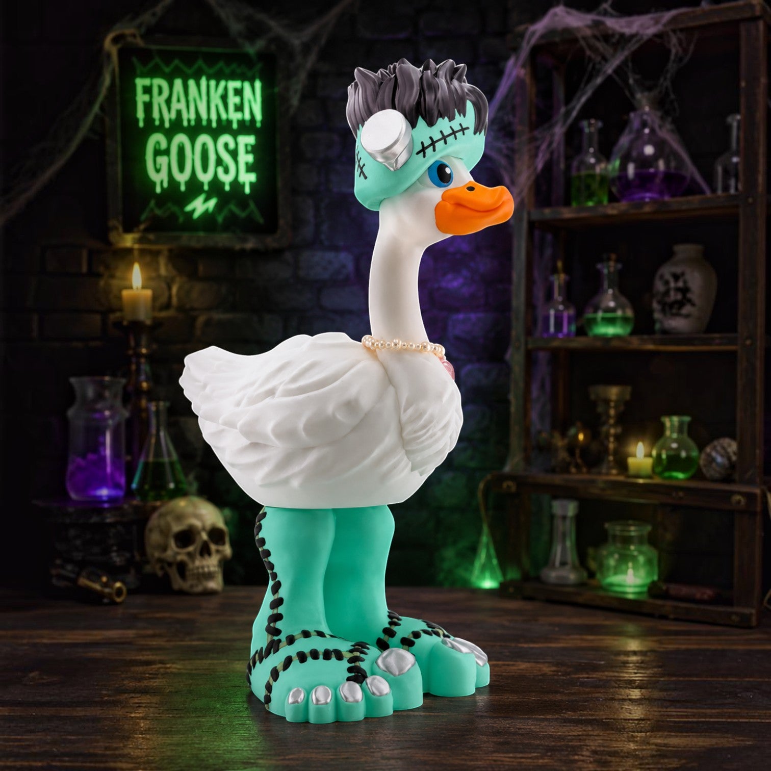 Prints & Giggles 3D Franken Goose outfit featuring a teal Frankenstein hat and monster feet on a white goose figure.