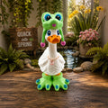 Prints & Giggles 3D goose figurine wearing a green frog hat with pink pompoms and matching green frog feet