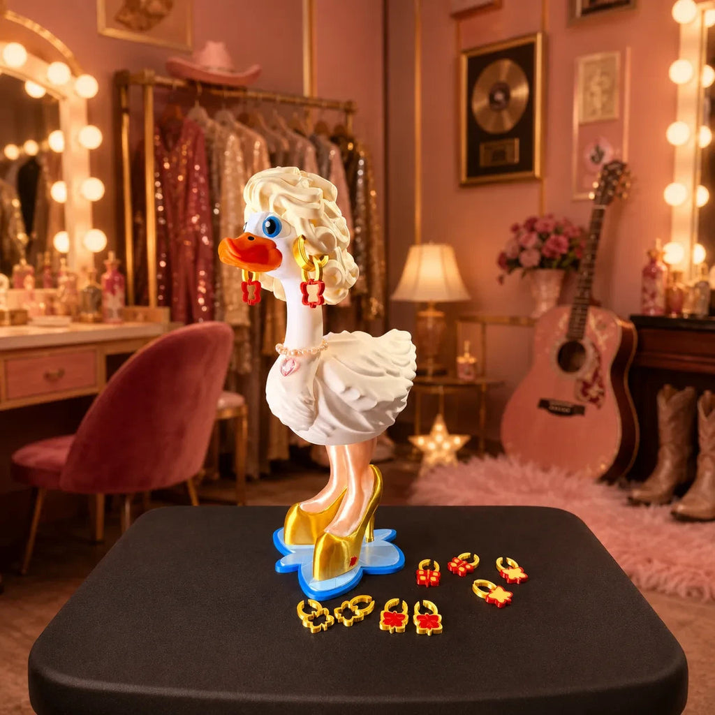 Dolly Dress-Up Goose outfit with blonde hair pearl necklace interchangeable earrings and gold heels