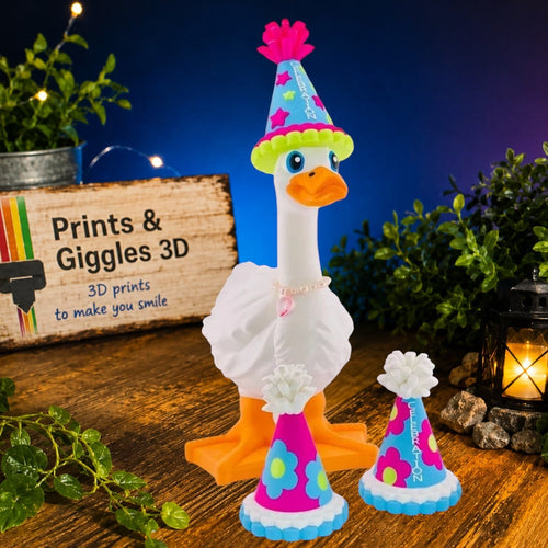 Prints & Giggles 3D white goose figurine wearing a blue party hat with two additional matching miniature party hats