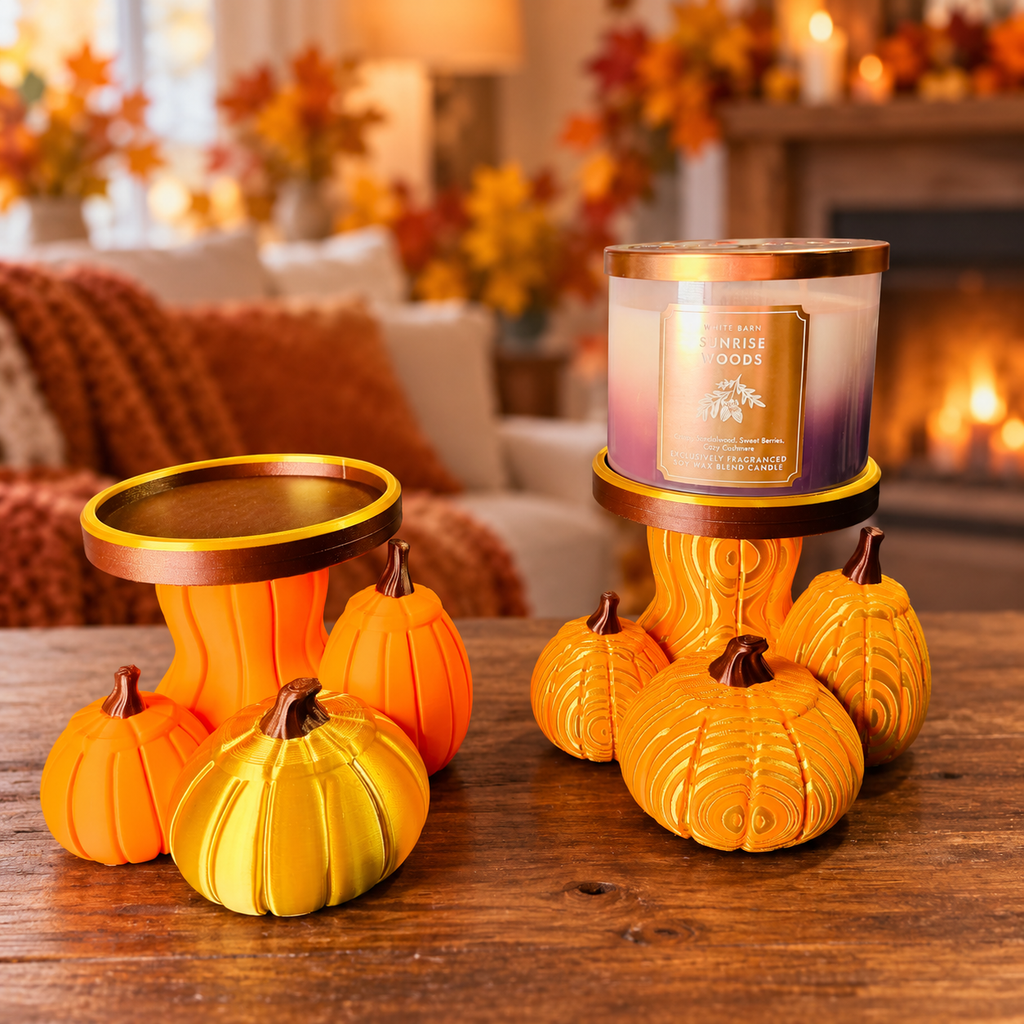 Solid and swirled 3D printed pumpkin candle holders on an autumn table